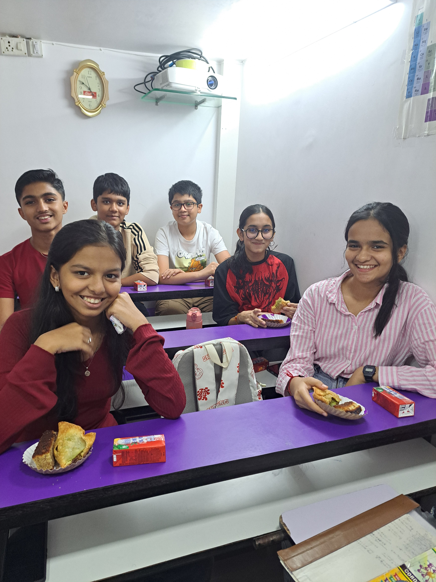 Students enjoying refreshments together in the classroom